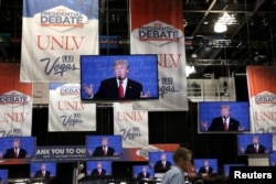 Media members listen to the third and final 2016 presidential campaign debate between Republican U.S. presidential nominee Donald Trump and Democratic U.S. presidential nominee Hillary Clinton at UNLV in Las Vegas, Nevada, Oct.19, 2016.