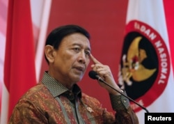Indonesia Chief Security Minister Wiranto delivers a speech during a meeting between former militants and victims in Jakarta, Indonesia, Feb. 28, 2018.