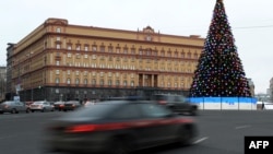 Cars drive past the headquarters of the FSB security service, the successor to the KGB in central Moscow on December 30, 2016.