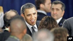 President Barack Obama greets supporters after giving closing remarks at a small business forum at Cleveland State University in Cleveland, Ohio, February 22, 2011