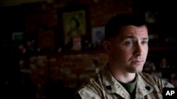 FILE - U.S. Marine Sergeant Lawrence Hutchins III poses for a portrait.