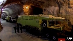 This image from an Oct. 14, 2015, broadcast on the Islamic Republic of Iran News Network reportedly shows missile launchers in an underground tunnel at an unknown location in Iran.