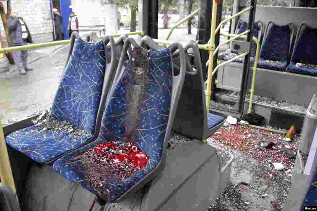 An interior view shows a damaged bus, hit by mortar fire. A Reuters cameraman said he saw six bodies on the ground near and inside the bus, Donetsk, Jan. 22, 2015.