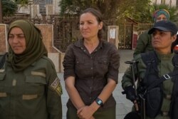 Haval Heline, 34, says her troops will never give up, despite recent losses. "We will fight for it until our last drop of blood," she says. (Yan Boechat/VOA)