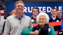 Barbara Bush jokes with her son, Republican presidential candidate Jeb Bush, while introducing him at a town hall meeting at West Running Brook Middle School in Derry, N.H., Feb. 4, 2016.