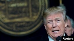 Displaced Tigrayan women who fled from the town of Samre, roast coffee beans over a wood stove at the Hadnet General Secondary School which has become a makeshift home to thousands displaced by the conflict, in Mekele, in the Tigray region of northern Ethiopia.