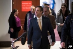 FILE - Michael Cohen, President Donald Trump's former lawyer, leaves a closed-door interview before the House Intelligence Committee at the end of three days of congressional testimony, in Washington, Feb. 28, 2019.
