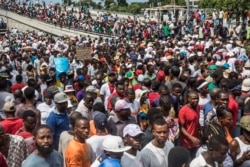 Demonstrators take part in a protest demanding the resignation of President Jovenel Moise in the Haitian capital in Port-au-Prince, Oct. 20, 2019.