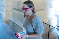 Sen. Kyrsten Sinema, D-Ariz., arrives for a vote on Capitol Hill, Nov. 1, 2021.