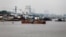 FILE - Fishing vessels are seen docked along the Congo River in the Democratic Republic of Congo's capital Kinshasa, Dec. 21, 2016. A current drought has left water levels in the Congo River at their lowest point in the past 100 years.