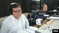 FILE - Son Chay is a member of parliament of Sam Rainsy Party and Phay Siphan is a spokesman of Council of Ministers of Cambodia.