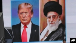 FILE - A huge screen shows U.S. President Donald Trump, left, and Iranian Supreme Leader Ayatollah Ali Khamenei in Tokyo, Jan. 8, 2020. Trump has revived his "maximum pressure" on Iran policy from his first term, but with significant changes.