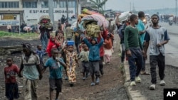 People displaced by the fighting with M23 rebels make their way to the center of Goma, Democratic Republic of the Congo, Jan. 26, 2025. 