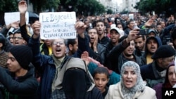 Anti-government protesters shout during a rally organized by the Moroccan Arab Spring movement in Casablanca, Nov 20, 2011.