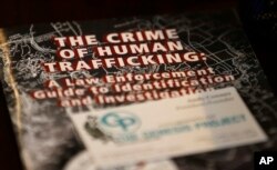 A law-enforcement guide to human trafficking sits on a table at The Genesis Project, a center for victims of sex trafficking in SeaTac, Washington, Feb. 27, 2017.