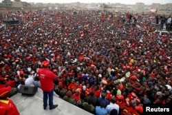 FILE - Kenya's President Uhuru Kenyatta speaks to the crowd during a Jubilee Party election rally in Nairobi, Kenya, July 21, 2017.