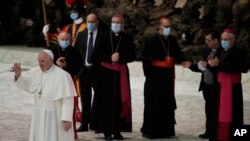 Pope Francis waves to faithful at the end of the weekly general audience in the Paul VI hall at the Vatican, Oct. 21, 2020.