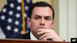FILE - Chairman Rep. Mike Gallagher listens during a hearing of a special House committee dedicated to countering China, on Capitol Hill in Washington, Feb. 28, 2023.