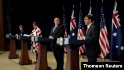 Australian Minister of Defense Linda Reynolds, left, Australian Foreign Minister Marise Payne and U.S. Secretary of State Mike Pompeo listen to U.S. Secretary of Defense Mark Esper at a news conference at the U.S. Department of State, July 28, 2020. 