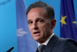 German Foreign Minister Heiko Maas addresses the media in Berlin, Dec. 17, 2020.