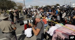 Law enforcement officials hold a news conference Tuesday, updating information on the Sunday shooting at the First Baptist Church of Sutherland Springs, Texas. A man opened fire in the church, killing more than two dozen and injuring others.