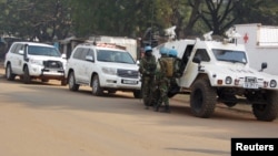 FILE - U.N. peacekeepers take a break as they patrol along a street during the presidential election in Bangui, the capital of Central African Republic, Dec. 30, 2015. 