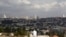 A view of Jerusalem is seen in the background as a man sits in Giv'at HaMatos, a neighborhood on the southern fringes of Jerusalem's city limits where Israel has decided to move forward on a settler housing project, Oct. 2, 2014. 