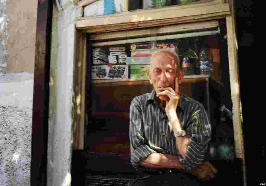 A shop owner in a Christian neighborhood in Damascus's old city. (J. Weeks/VOA)