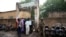 Security officers stand guard in front of a polling station during the Presidential elections in Bamako, Mali, July 29, 2018. 