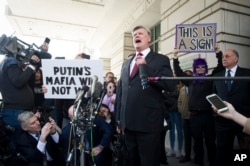 Keven Downing, Paul Manafort's attorney, speaks to reporters as he leaves federal court after Manafort's sentencing hearing in Washington, March 13, 2019.