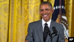 President Barack Obama smiles during an event with Young Southeast Asian Leaders Initiative fellows in the East Room of the White House, June 1, 2015.