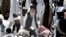FILE - Pakistan's hard-line cleric Sufi Muhammad, center, arrives to address his supporters in Mingora capital, Swat Valley, April 19, 2009. 
