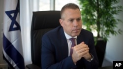 FILE - Israeli Public Security Minister Gilad Erdan speaks during an interview with The Associated Press in his office in Bnei Brak, east Tel Aviv, Oct. 26, 2017.