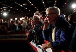 Supporters of Democratic presidential candidate and former Vice President Joe Biden participate at a rally at the Drake University Olmsted Center in Des Moines, Iowa, Feb. 3, 2020.