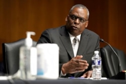 FILE - Then-Secretary of Defense nominee Lloyd Austin speaks during his confirmation hearing before the Senate Armed Services Committee on Capitol Hill, Jan. 19, 2021.