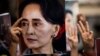 FILE - A protester holds a photo of detained Myanmar civilian leader Aung San Suu Kyi during a demonstration against the military coup outside the Myanmar Embassy in Bangkok on Feb. 7, 2021.