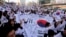 South Koreans give three cheers for the country as they march during a rally to mark the centennial of the March First Independence Movement Day against Japanese colonial rule (1910-45), in Seoul, South Korea, March 1, 2019.