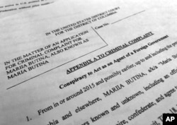 Court papers unsealed, July 16, 2018, photographed in Washington, shows part of the criminal complaint against Maria Butina.