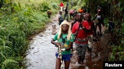 FILE - Members of the anti-Balaka, a Christian militia, patrol outside the Central African Republic village of Zawa April 8, 2014. 