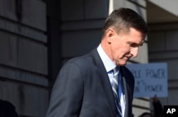 FILE - Former Trump national security adviser Michael Flynn leaves federal court in Washington, Dec. 1, 2017.