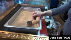 Syrian Coffee traditionally boiled in heated sands.