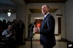 FILE - Rep. Adam Schiff, chairman of the House Intelligence Committee, talks to reporters at the Capitol in Washington, March 6, 2019.