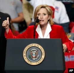 Appointed U.S. Sen. Cindy Hyde-Smith, R-Miss., with President Donald Trump, speaks during a rally, Nov. 26, 2018, in Biloxi, Miss.