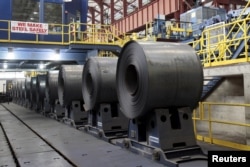 FILE - Rolled steel is seen after being treated on the pickle line at the Severstal steel mill in Dearborn, Michigan, June 21, 2012.