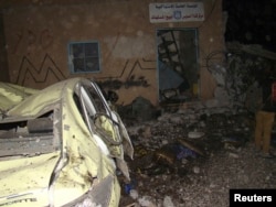 A view of the damage from a suicide bombing at the Kurdish Internal Security Forces Center (Asayish) at the Suez Canal neighborhood in Qamishli, Syria, Nov. 23, 2013.