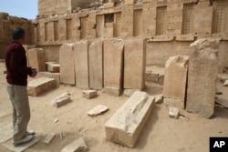 A Yemeni official explores the Awwam Temple, also known as the Mahram Bilqis, in Marib, Yemen, Feb. 3, 2018.