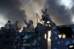 Smoke rises from Islamic state positions after an airstrike by coalition forces in Mosul, Iraq, Oct. 18, 2016.