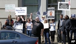 Opponents of House Bill 2 protest across the street from the North Carolina State Capitol in Raleigh, N.C., April 11, 2016.