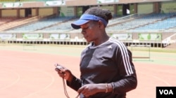 Coach Caroline Kola hopes her 32 young athletes will excel in their various events. (L. Ruvaga/VOA)