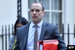 Britain's Secretary of State for Exiting the European Union (Brexit Minister) Dominic Raab leaves Downing Street in London, Nov. 14, 2018.